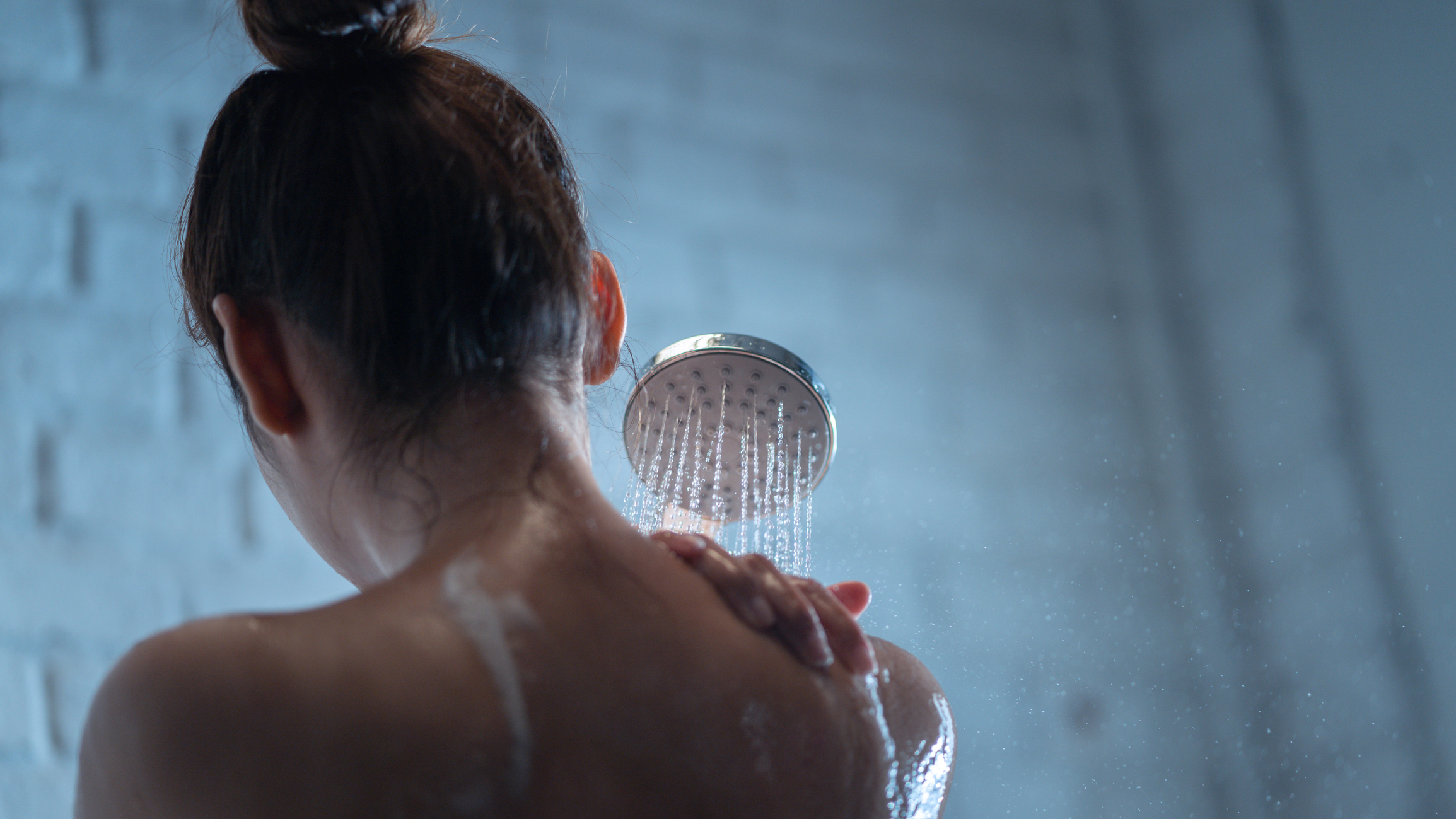 A back side image of women with shower